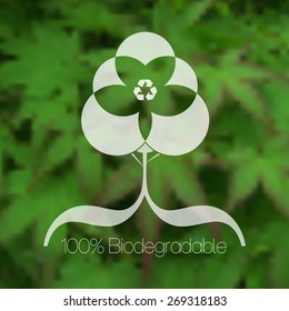 Diseño ecológico de árbol contra fondo verde borroso.