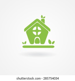 Eco house with green leaves. Vector logo. Ecological  icon.