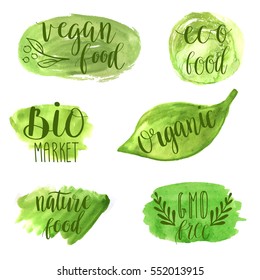 Eco, nature, vegan, bio food logos. Handwritten lettering. Vector elements for labels,  badges, stickers or icons. Calligraphic and typographic collection on green watercolor banners.
