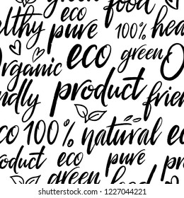 Eco seamless pattern.  Hand written lettering with leaves and hearts. Organic product, bio, natural background. Typography design.  Creative pattern for print, textile, flyer design, wear, templalate.