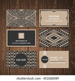  Eco style business card collection set.Ethnic tribal style business card collection on wood background.