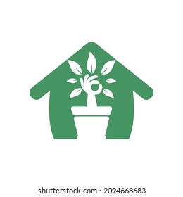 Ecological garden home vector logo design. Hand tree with flower pot icon design.	