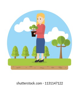 ecology woman planting trees in the landscape