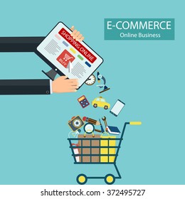 E-commerce. Shopping online. Computer and goods in the shopping cart. Stock vector illustration.