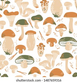 Edible Mushrooms seamless pattern. Linocut old style. Hand drawn vector illustration. Warm colors.