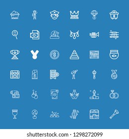 Editable 36 gold icons for web and mobile. Set of gold included icons line Vuvuzela, Pedestal, Investment, Gold, Money tree, Goblet, Rings, Winning, Money, Earrings on blue background