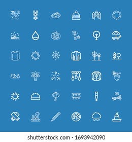 Editable 36 season icons for web and mobile. Set of season included icons line Pudding, Snow, Thermometer, Trees, Scarf, Sunbed, Garlands, Umbrella, Bush, Sun on blue background