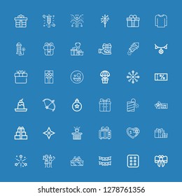 Editable 36 xmas icons for web and mobile. Set of xmas included icons line Bow, Cracker, Garlands, Gifts, Christmas party, Fireworks, Gift, Star, Voucher, Petard on blue background