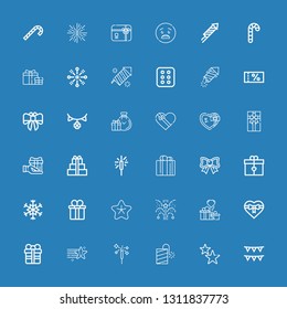 Editable 36 xmas icons for web and mobile. Set of xmas included icons line Garlands, Stars, Petard, Fireworks, Star, Gift, Gifts, Gift box, Snowflake, Bow, Sparkler on blue background