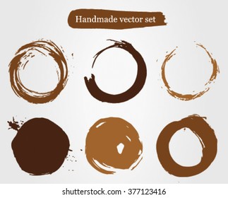 Editable dark and light brown and cream handmade brush stroke coffee cup mug stain circles vector set