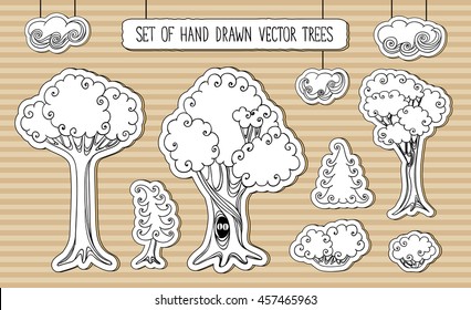 Editable set of hand drawn cardboard trees, bushes and clouds.Magical fairy tale branching woods. Vector illustration.
