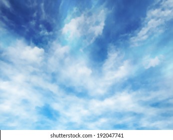 Editable vector illustration of high white clouds in a blue sky made using a gradient mesh