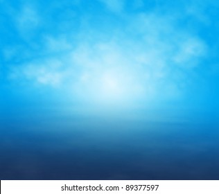 Editable vector illustration of a misty light over water in blue made with a gradient mesh