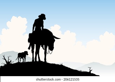 Editable vector silhouette of a weary traveler riding his donkey with dog following