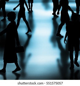 Editable vector silhouettes of people walking in a crowded hall with shadows made using a gradient mesh