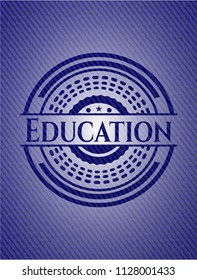 Education badge with denim background