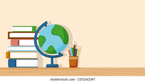 Education concept - globe, books and pencils on the table