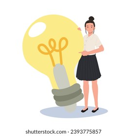 Education and Creativity concept. Thai University Student with big Light Bulb Idea
