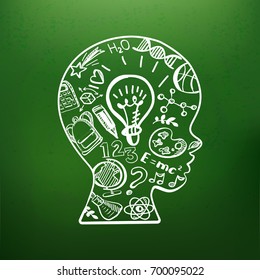 Education doodle style symbols in boys head on chalkboard. Vector illustration. Kids face profile contour with sketch lamp and over icons. Contour of schoolboy profile.