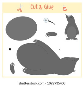 Education paper game for the development of preschool children. Cut parts of the image and glue on the paper. Vector illustration. Use scissors and glue to create the applique. mole animal