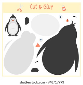 Education paper game for the development of preschool children. Cut parts of the image and glue on the paper. Vector illustration. Use scissors and glue to create the applique. penguin