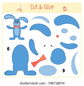 Education paper game for the development of preschool children. Cut parts of the image and glue on the paper. Vector illustration. Use scissors and glue to create the applique. hare