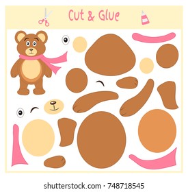 Education paper game for the development of preschool children. Cut parts of the image and glue on the paper. Vector illustration. Use scissors and glue to create the applique. Bear in scarf. Teddy