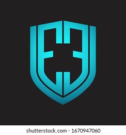 EE Logo monogram with emblem shield design isolated with blue colors on black background