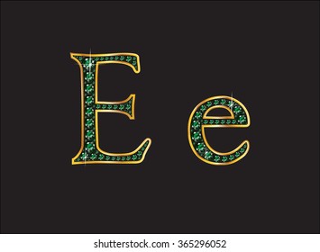 Ee in stunning emerald precious round jewels set into a 2-level gold gradient channel setting, isolated on black. Vector EPS-10 file, transparency used. 