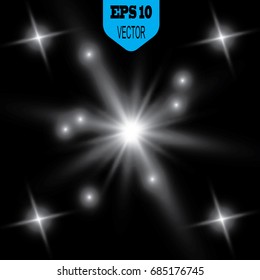 The effect of glowing lights, flash, explosion and stars. Special effect isolated on a dark background.