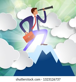effective manager looks into telescope into distance trying to predict future. businessman standing on top of mountain among clouds in rays of sunlight. business vision concept