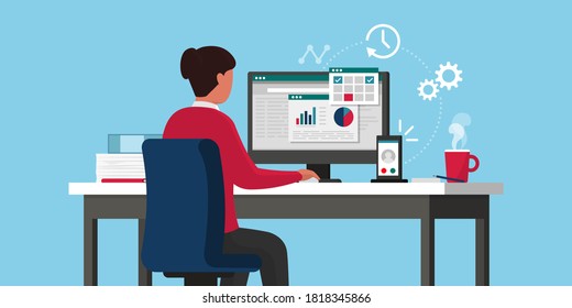 Efficient businesswoman working online, she is sitting at desk and checking business charts on the computer, remote work concept