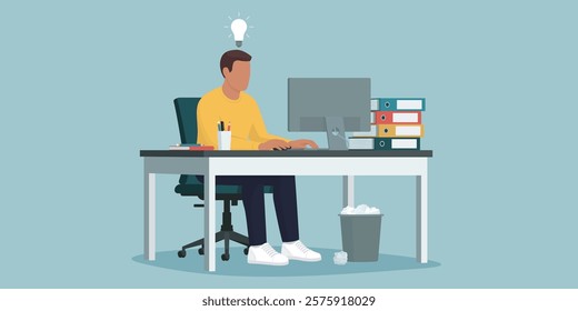 Efficient creative young employee sitting at the office desk and working with a computer