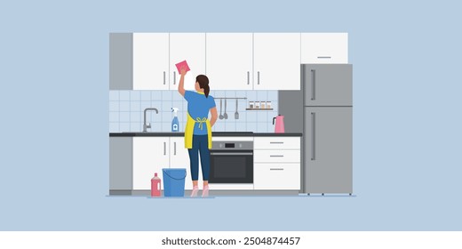 Efficient housewife cleaning the kitchen, she is rubbing the cabinets with a sponge