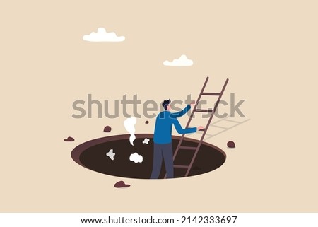 Effort and brave to solve business problem, get out of crisis or escape from trouble situation, reaching goal or solution concept, businessman survivor climb up ladder out of the hole or deep crater.