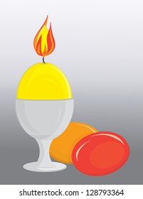 egg candle in eggcup and easter eggs