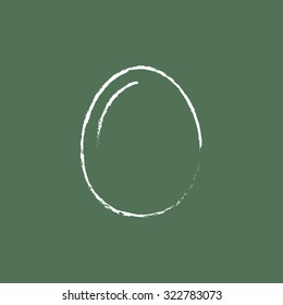 Egg hand drawn in chalk on a blackboard vector white icon isolated on a green background.