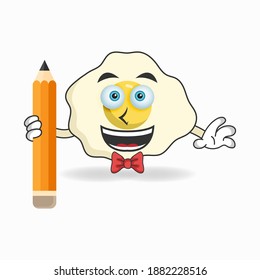 Egg mascot character holding a pencil. vector illustration