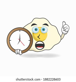 Egg mascot character holding a wall clock. vector illustration
