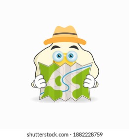 The Egg mascot character holds a map. vector illustration