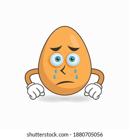 Egg mascot character with sad expression. vector illustration