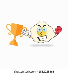 The Egg mascot character wins a boxing trophy. vector illustration