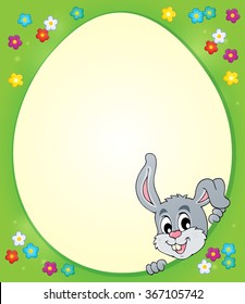 Egg shaped frame with lurking bunny 1 - eps10 vector illustration.