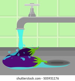 Eggplant being cleaned and washed in a sink in a kitchen. Running tap water.