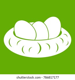 Eggs in the nest icon white isolated on green background. Vector illustration