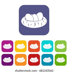 Eggs in the nest icons set vector illustration in flat style in colors red, blue, green, and other