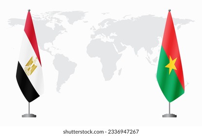 Egypt and Burkina Faso flags for official meeting against background of world map.