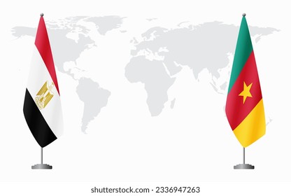 Egypt and Cameroon flags for official meeting against background of world map.