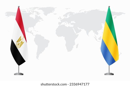 Egypt and Gabon flags for official meeting against background of world map.