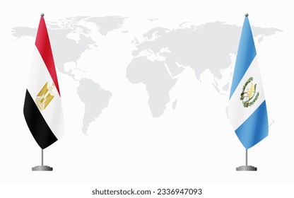 Egypt and Guatemala flags for official meeting against background of world map.